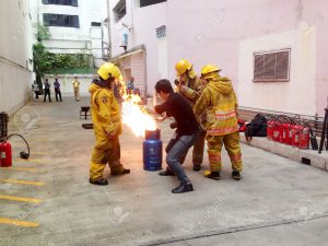34715796-practicing-about-how-to-extinguish-the-fire-by-turning-off-the-stock-photo